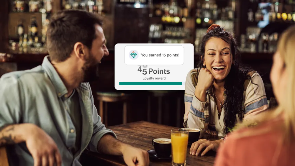 Customers enjoying in a bar and earning loyalty points