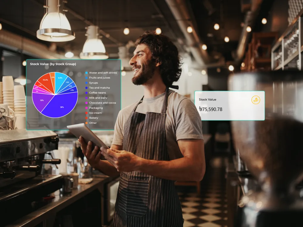 Cafe owner checking ingredient stock levels on a phone with RestroGreen inventory