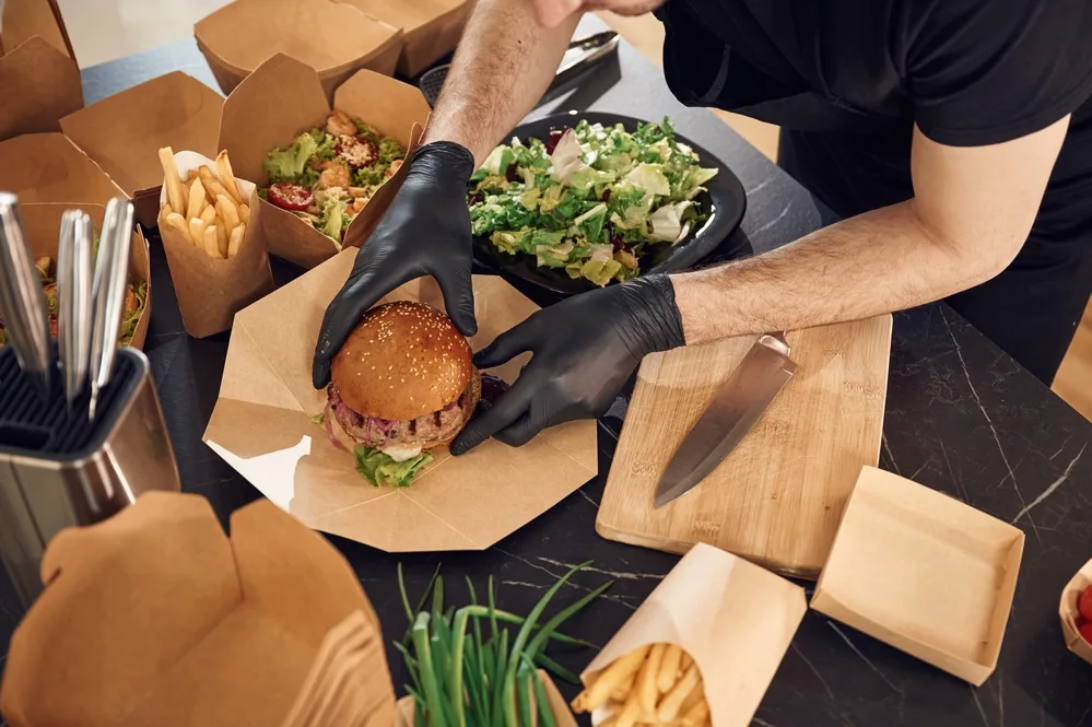 packing burger for a takeaway delivery order