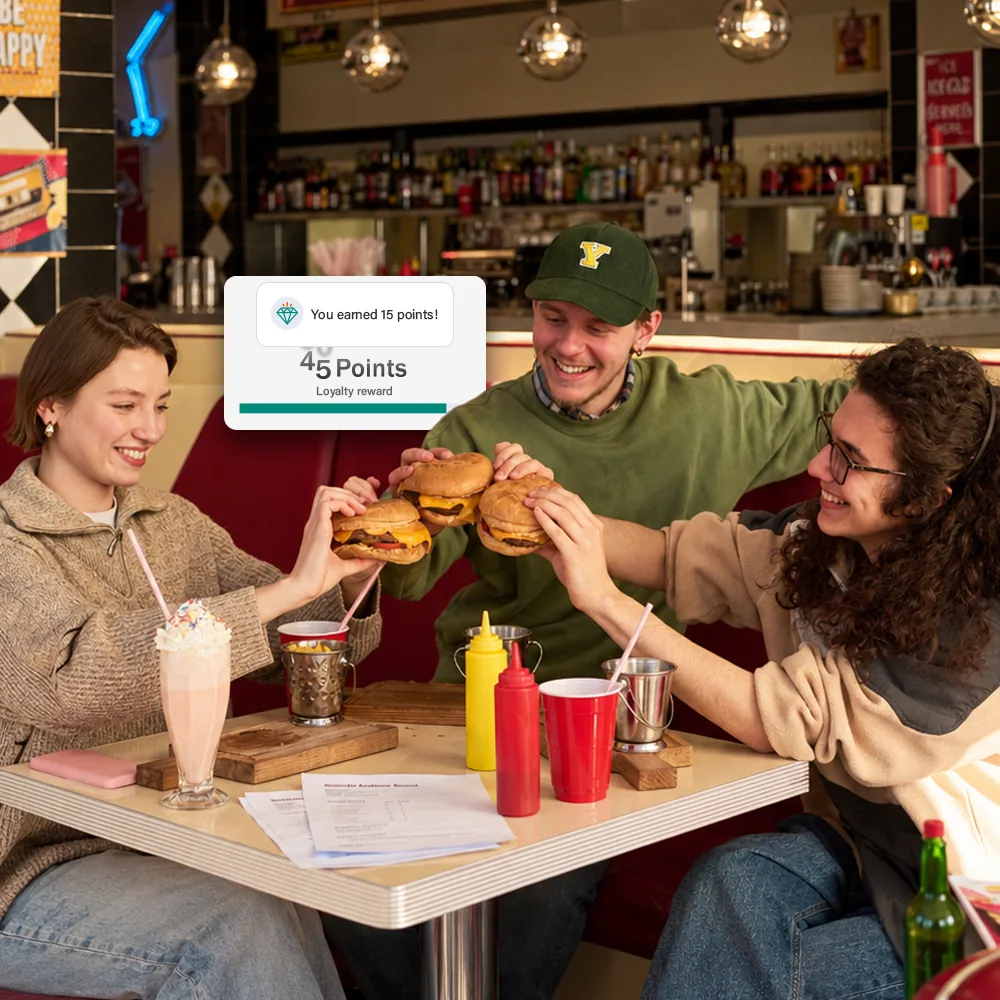 Customers enjoying food and earning loyalty points through restrogreen